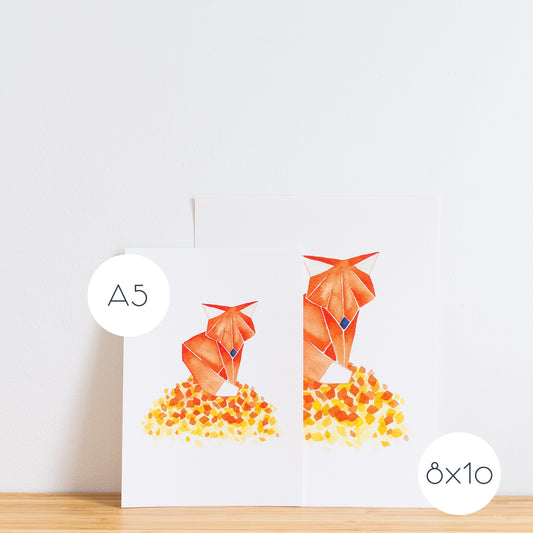 Watercolour painting art print. The watercolour illustration shows an origami autumn fox standing on top of a pile of autumn leaves.