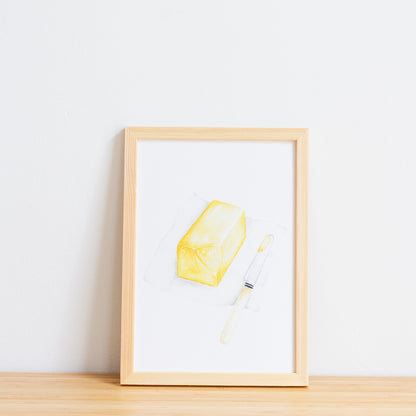 Watercolour colour art print. This watercolour illustration shows a block of butter on paper with a butter knife on the side.