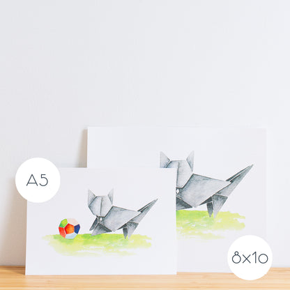 Watercolour painting art print. The watercolour illustration shows an origami grey cat playing with a colourful origami ball.