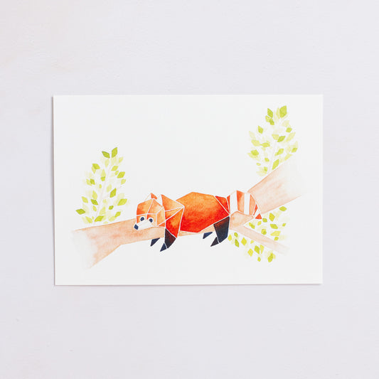 Watercolour painting art print. The watercolour illustration shows an origami red panda lying down on a tree branch with leaves.